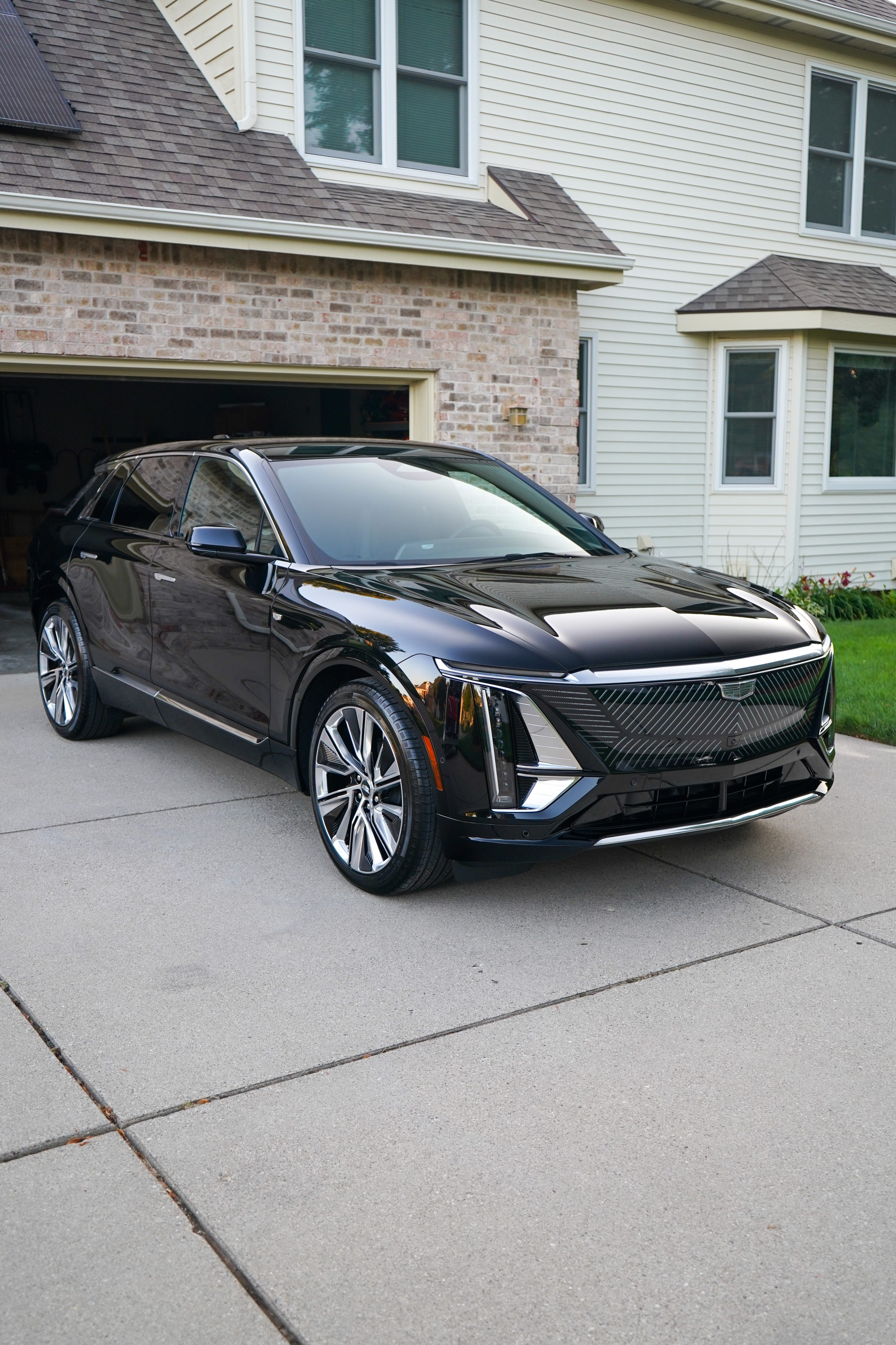 Cadillac Lyriq with System X ceramic coating, side profile in driveway