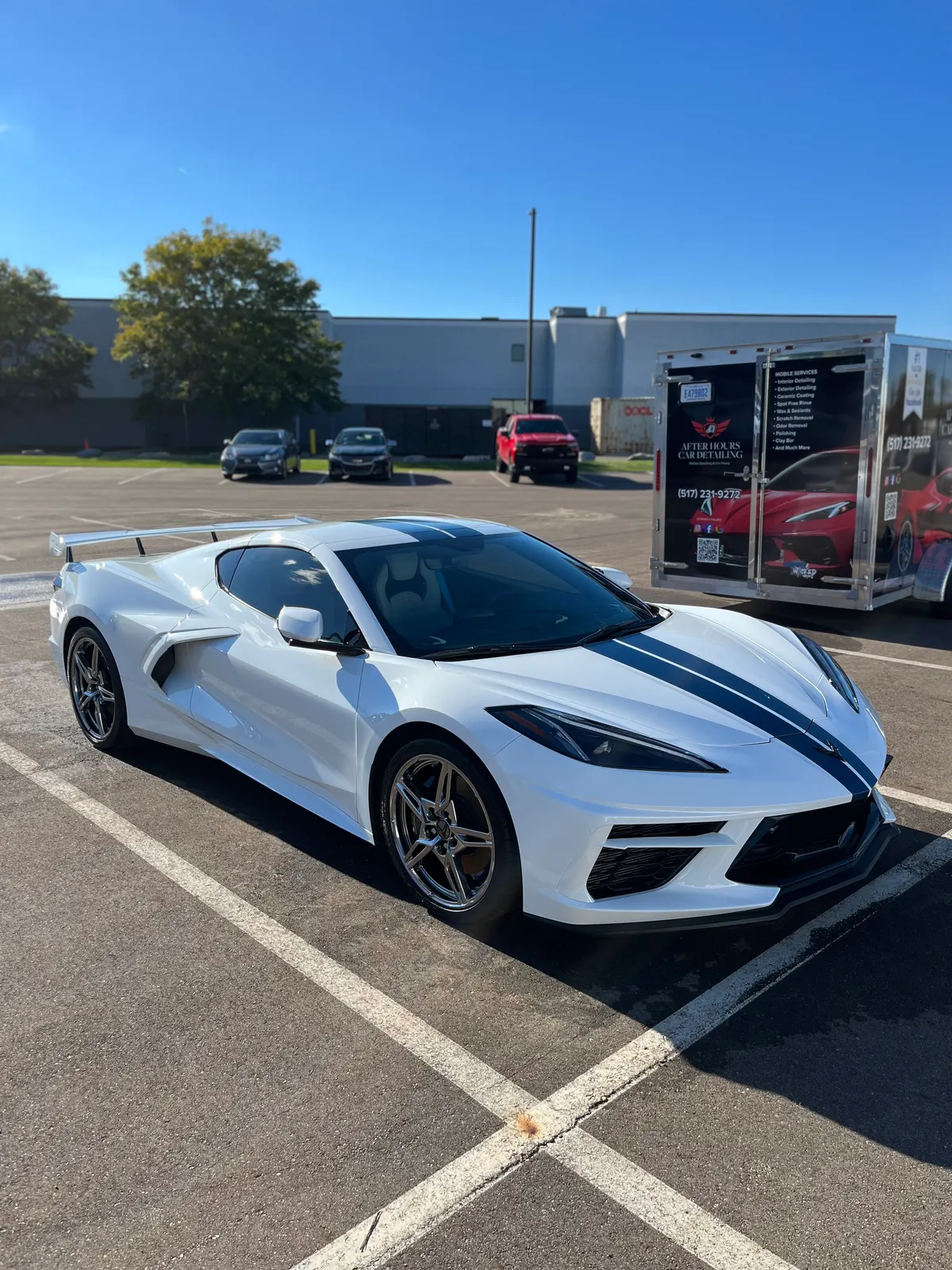 White Chevrolet Corvette C8 Stingray with blue stripes after a full detail by After Hours Car Detailing in Mid-Michigan